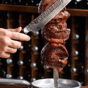 slicing meat on the skewer