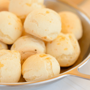 A plate of Brazilian Cheese Bread laid out at the diner table