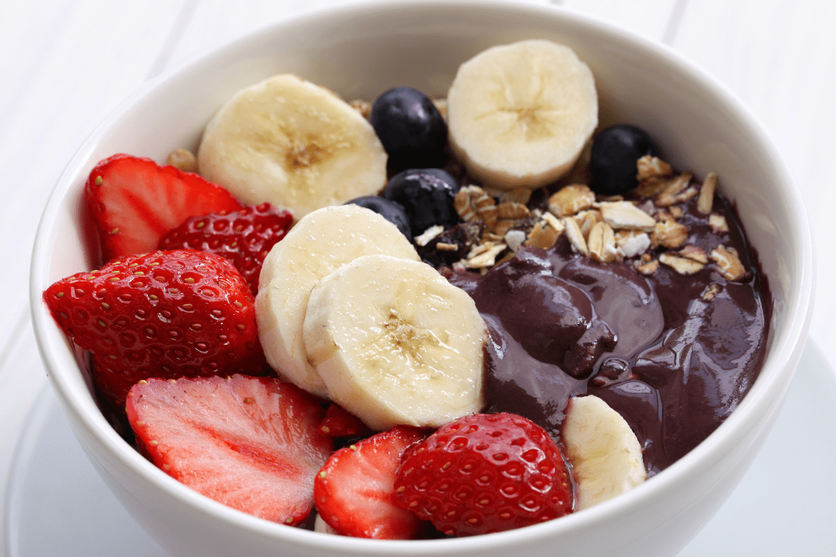 acai bowl with granola, strawberries, and banana