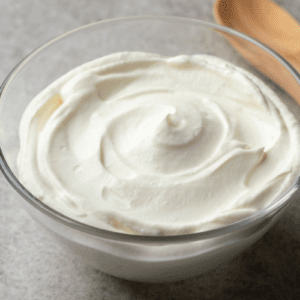 Brazilian cream cheese in glass bowl with wooden spoon