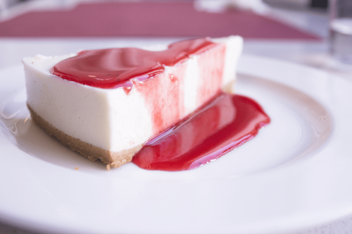 guava cheesecake on white plate