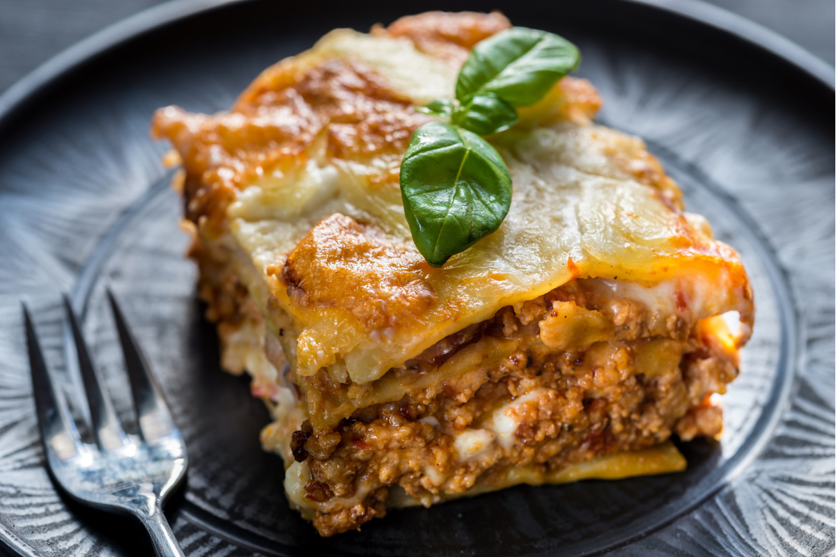 Brazilian lasagna with white sauce and layers of ham