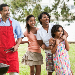 Family around grill for cookout