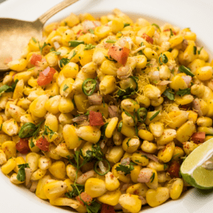 grilled corn salad with a lime wedge garnish