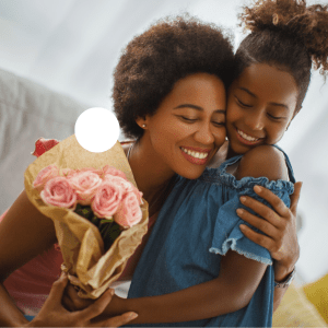 young girl gives roses to her mother for Mother's Day