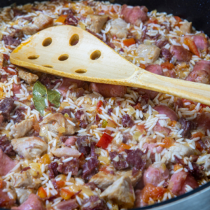 Pot of arroz carreitero, long grain Brazilian rice with leftover barbecue meats