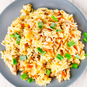 Greek rice pilaf with carrots and spring onions