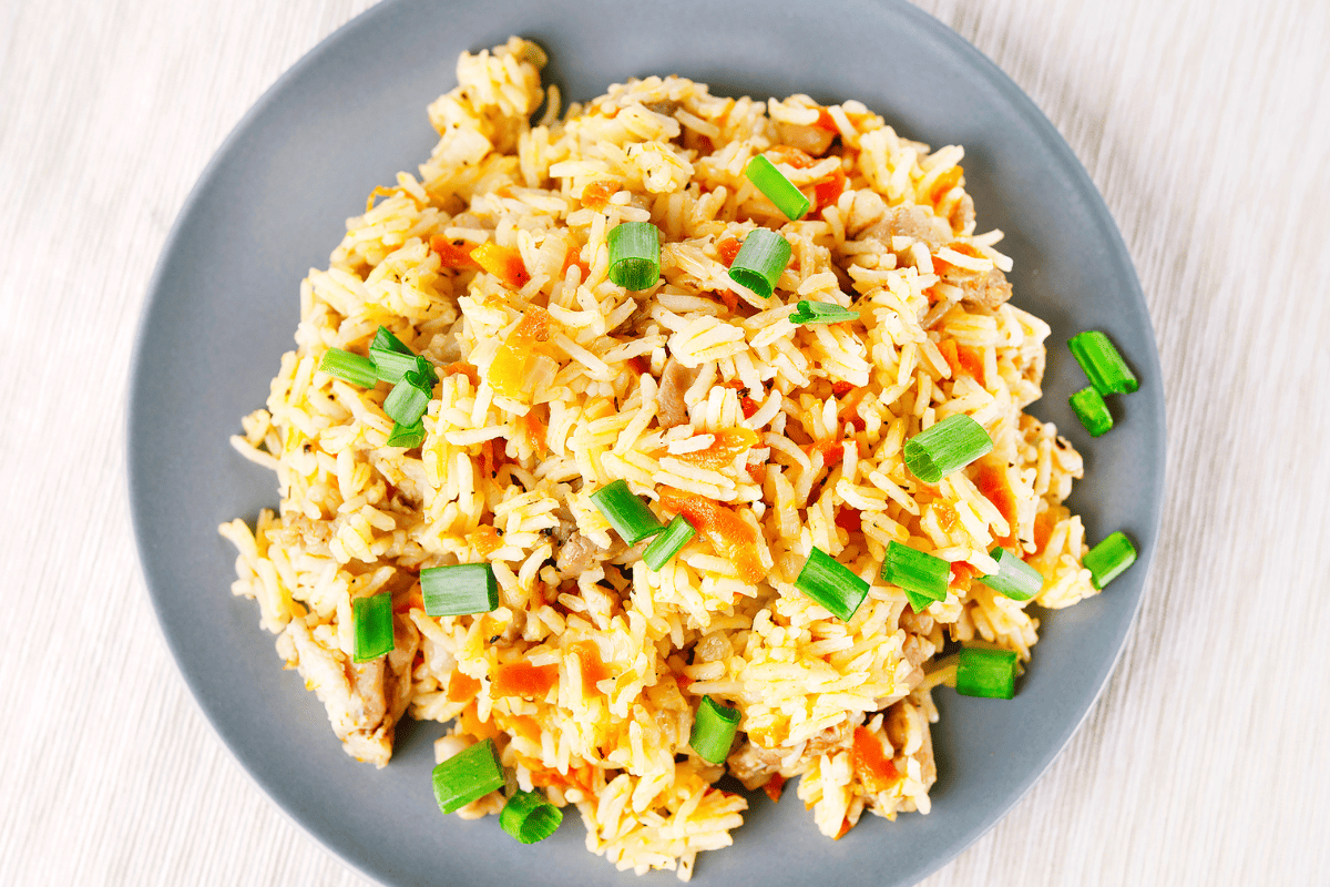 Greek rice pilaf with carrots and spring onions