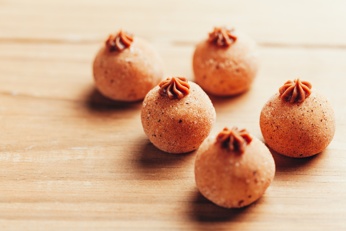 pumpkin fudge balls (brigadeiros) with cinnamon sugar dusting