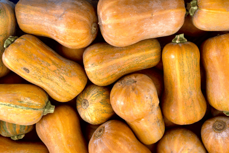 a stack of orange honeynut squash