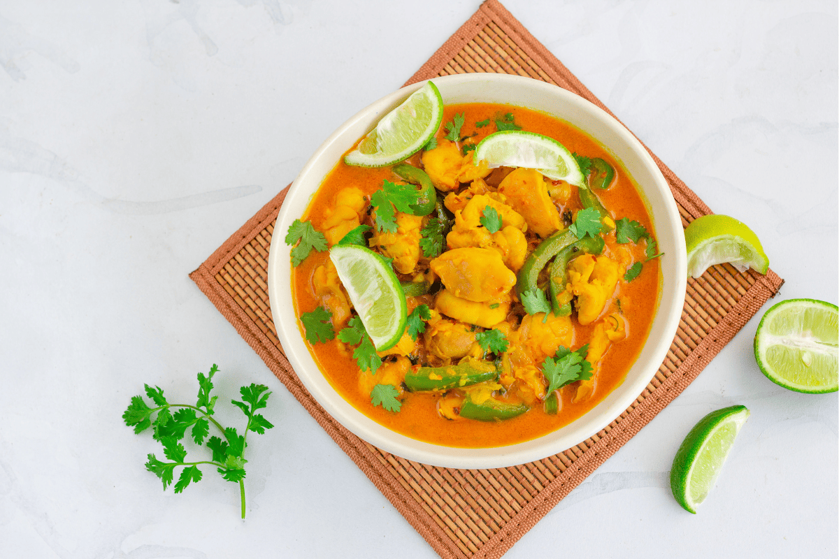 coconut lime chicken with fresh lime and cilantro garnishes