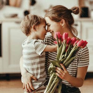 child giving mother tulips to wish her Happy Mother's Day