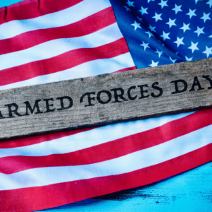 American flag with a wooden plaque reading "Armed Forces Day"