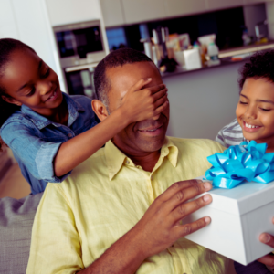 kids surprising Dad with gifts for Father's Day