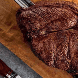 alcatra top sirloin on roasting spit and cutting board