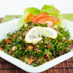 tabouleh salad with lemon garnish